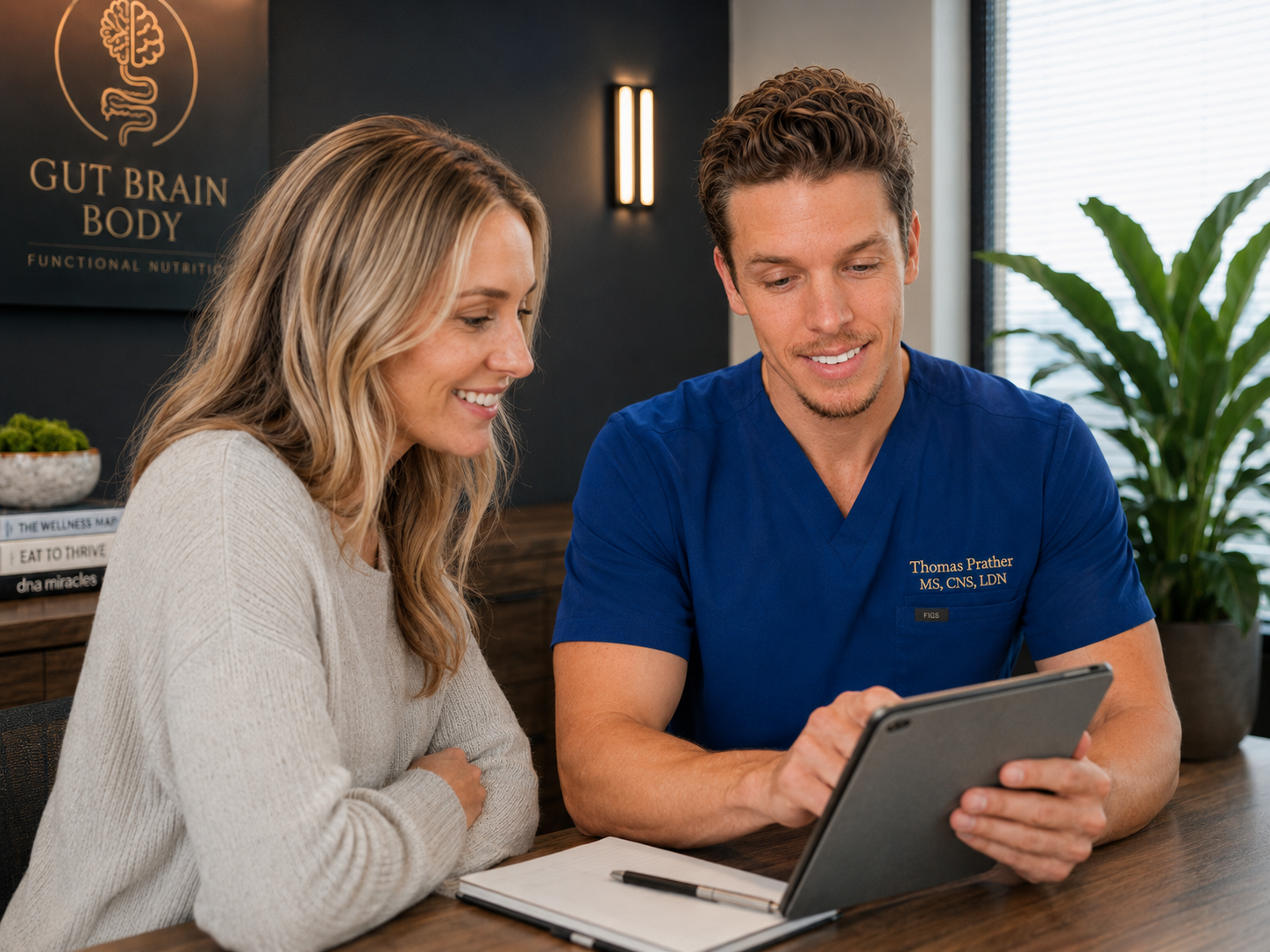 Functional nutrition consultation with Thomas and a client reviewing a personalized care plan